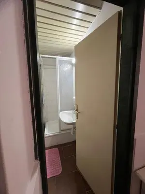 a bathroom with a sink and a toilet in a room at Apartmani Vrnjacka Banja 7 in Vrnjačka Banja