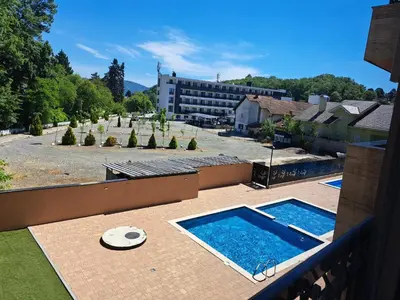 a view of a swimming pool on a balcony at Slatinski mir in Vrnjačka Banja