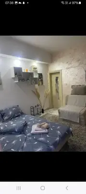 a bedroom with a bed and a bed and a couch at ---Apartmani Radosavljevic--- in Vrnjačka Banja