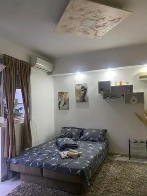 a bedroom with a bed in a room with a ceiling at ---Apartmani Radosavljevic--- in Vrnjačka Banja