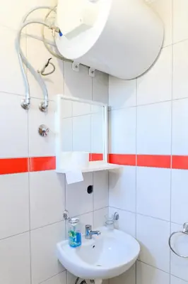 a bathroom with a sink and a mirror at Studio Merlin 4 in Soko Banja