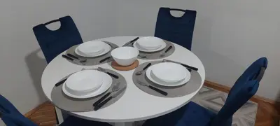 a white table with hats and utensils on it at 3M Lux Niš in Niš