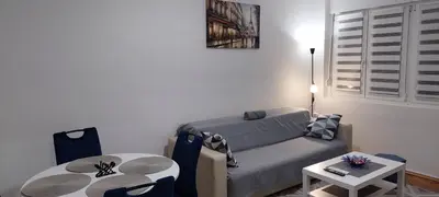 a living room with a couch and a table at 3M Lux Niš in Niš