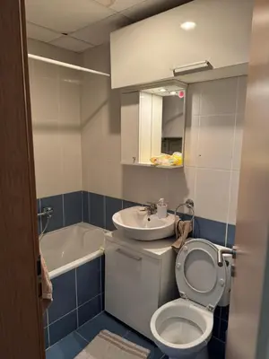 a bathroom with a toilet and a sink at bozicapartments in Jagodina