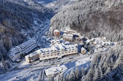 an aerial view of a train station in the snow at Apartman Stagira - Bela Reka Gondola, Kopaonik in Brzeće