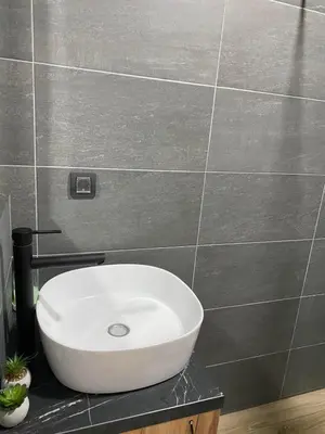 a white sink on a counter in a bathroom at Mountain Soul - Residence Hill in Kopaonik