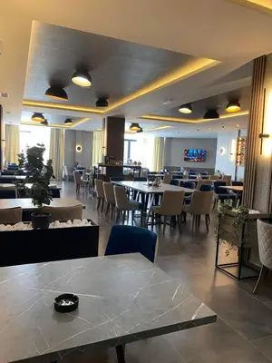 a restaurant with tables and chairs and a dining room at Mountain Soul - Residence Hill in Kopaonik