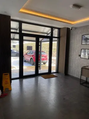 an empty room with doors to a parking lot at Mountain Soul - Residence Hill in Kopaonik