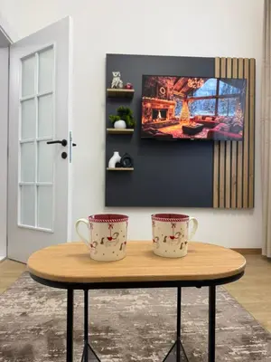 two tea cups sitting on a table in a room at Apartman Djurdja in Raška