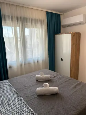 a bedroom with two towels on a bed at Nik 2 in Kruševac