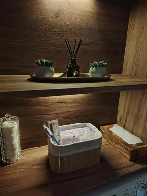 a wooden shelf with a box with a toothbrush in it at Lux Veritas- besplatan parking-100 metara od Vinarije Grabak in Vrnjačka Banja