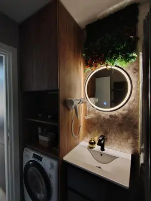a bathroom with a sink and a mirror at Lux Veritas- besplatan parking-100 metara od Vinarije Grabak in Vrnjačka Banja