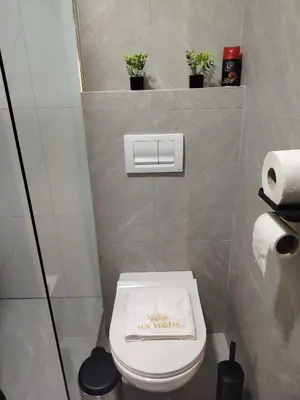a bathroom with a toilet with a sign on it at Lux Veritas- besplatan parking-100 metara od Vinarije Grabak in Vrnjačka Banja