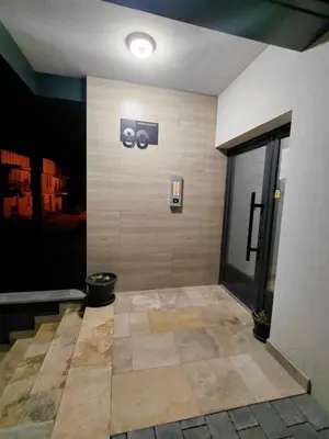 a lobby of a building with a sign on the wall at DragonVB in Vrnjačka Banja