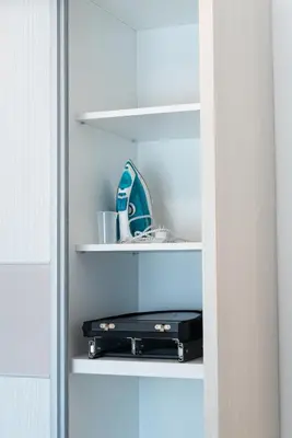 a closet with a book shelf with a stereo at Portofino in Vrnjačka Banja