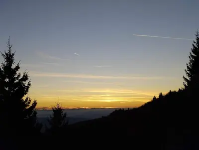 a view of the sun setting over the ocean at Mountain home Borut in Kopaonik
