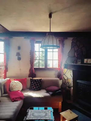 a living room with a couch and a fireplace at Mountain home Borut in Kopaonik