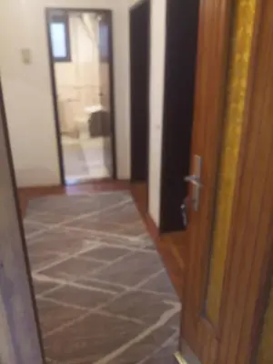 a room with a door and a tile floor at Apartman Mina in Kuršumlija