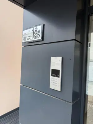 a blue refrigerator with a sign on top of it at Emerald Residence in Vrnjačka Banja
