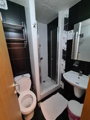 a bathroom with a toilet and a sink at Centar slope 3 apartman in Kopaonik