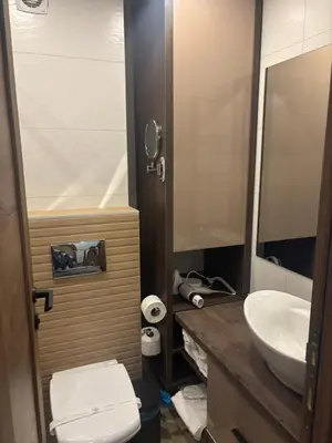 a bathroom with a toilet and a sink at Apartman u hotelu Harmonija Palace Kopaonik in Kopaonik