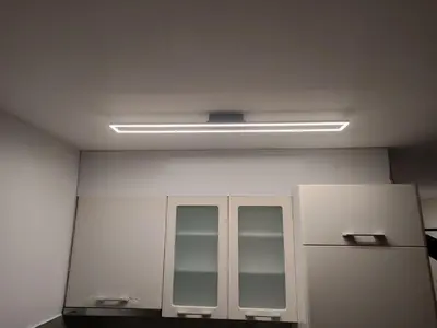 a white room with a light on the ceiling at D&D Apartment in Vrnjačka Banja