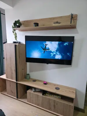 a flat screen tv sitting on top of a wooden entertainment center at Pilot peak in Kopaonik