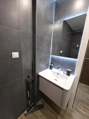 a bathroom with a sink and a mirror at Pilot peak in Kopaonik