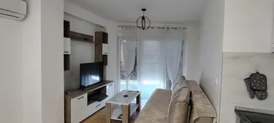 a living room with a couch and a television at Apartman CiricMDV in Vrnjci
