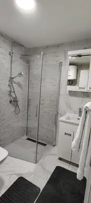 a bathroom with a shower and a sink at Apartman CiricMDV in Vrnjci