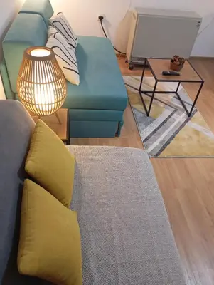 a living room with a couch and a table at Gondola Lux Apartment in Brzeće