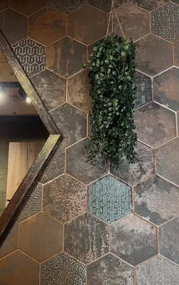 a green plant on the floor of a room at Kaizen Cabin in Kursumlijska Banja