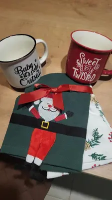 a santa claus napkin next to a coffee cup at Apartmani NANA in Vrnjci