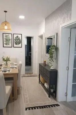 a living room with a table and a dining room at Apartmani NANA in Vrnjci