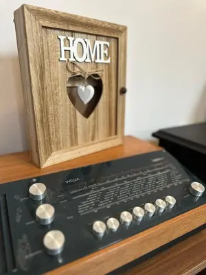 a wooden box with a heart and the words home at Chalet Pinecone - Ušuškan apartman, savršen za zimu i leto - Modern Mountain Retreat with Stunning View in Kopaonik