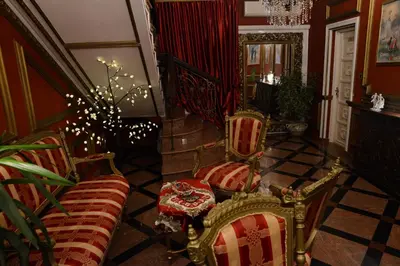a living room with two chairs and a couch at Apartmani Vivaldi Niš in Niš