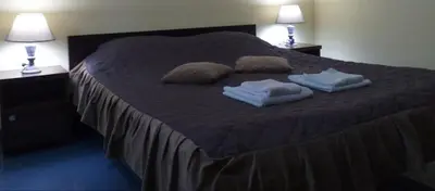 a bed with two towels and two pillows on it at Smeštaj Franica in Kuršumlija
