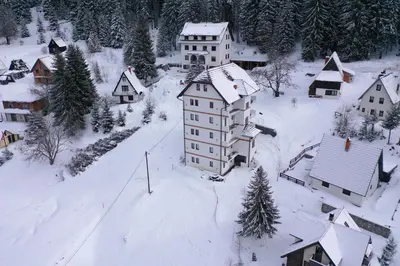 an aerial view of a village covered in snow at Apartment Petrović in Kopaonik
