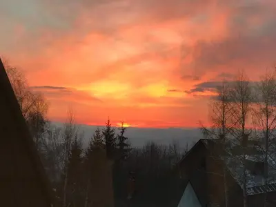 a sunset from the roof of a house at Apartment Planinska Carolija in Kopaonik