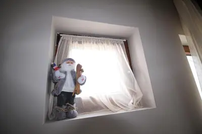 a group of stuffed animals sitting in a window at Apartment G10 Milmari resort in Kopaonik