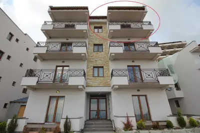 a building with balconies and stairs on it at Apartment G10 Milmari resort in Kopaonik