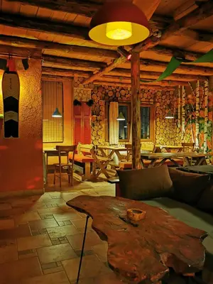 a living room with a couch and a table at Šum Apartmani - Stara planina in Crni Vrh