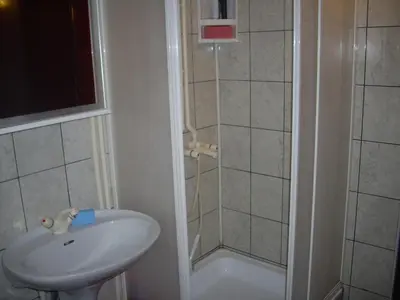 a bathroom with a sink and a shower at Guest House Nada in Soko Banja