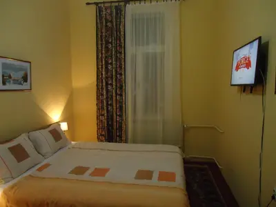 a hotel room with a bed and a window at Apartments Villa Svetlana in Vrnjačka Banja