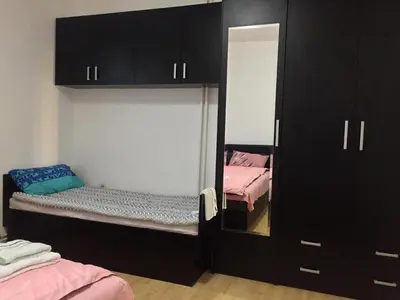 a small room with a mirror and a closet at Boulevard Apartments Cuprija in Ćuprija