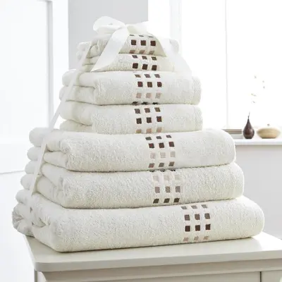 a stack of towels sitting on a table at Boulevard Apartments Cuprija in Ćuprija