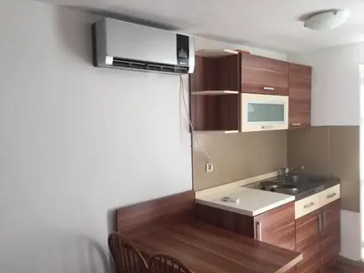 a small kitchen with a sink and a microwave at Boulevard Apartments Cuprija in Ćuprija