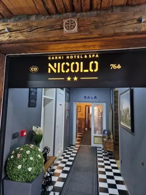 a sign for the entrance to a building at Garni Hotel & Spa Nicolo in Kruševac