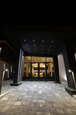 a view of a building with lights on the ceiling at Garni Hotel Zen free parking in Niš