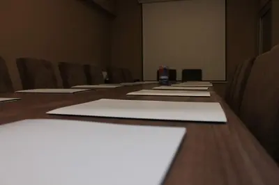 a conference room with a long table with chairs at Bed & Breakfast Park Gate in Vranje